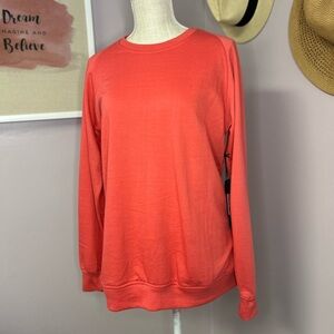 NWT Six Lincoln New York Medium beautiful coral color sweatshirt.